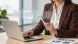 © Caleb - Professional woman signing digital documents on laptop screen using stylus, electronic signature workflow, paperless office concept