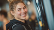 © Subin - A young woman smiles brightly at the gym, showcasing her joy and enthusiasm for fitness and health.