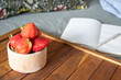 © Ina - Fresh strawberries on wooden tray beside notebook and laptop in home workspace. Healthy snack and remote work concept combining productivity, planning and comfortable indoor lifestyle.