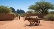 © verinton - Ox-drawn cart by gate with person, landscape with mountains in background
