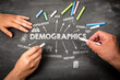 © STOATPHOTO - Demographics Chalkboard Diagram With Hands Drawing Social Data Indicators