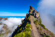 © ON-Photography - Ninho da Manta – a scenic trail near the summit of Pico do Arieiro on the island of Madeira, Portugal. A legendary mountain trail with steep cliffs on both sides of the path. Wide angle panorama.