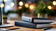 © Kateryna - A wide shot of two calm policies and procedure binders resting softly on a bright office desk procedure binders faceless still softly defocused backdrop bright office
