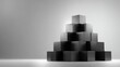 © Afifah - Black geometric boxes arranged in a pyramid on a minimalistic background