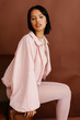 © Tania Cervian/Stocksy - Woman in stylish pink jacket