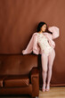 © Tania Cervian/Stocksy - Woman  in pink outfit
