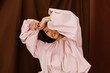 © Tania Cervian/Stocksy - Woman in stylish puffy pink jacket
