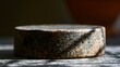 © Bussakon - A rear view shot highlights the rich natural textures and colors of a polished granite base with delicate shadows