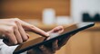 © Asit - Person interacting with a tablet device
