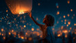© Natali IQstock - lantern, sky-lantern, festival, night, releasing, young man, glowing, floating, dreams, hope, celebration, traditional, darkness, magical, warm, orange light, blue sky, atmosphere, bokeh effect, spiri