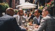 © Mas - Group of business men dining outdoors