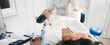 © Maria - Cropped panorama of gynecologist examining a patient who is sitting in a gynecological chair. Female health concept.