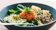 © David - Fresh salmon poke bowl with sliced avocado, quinoa, and greens in bowl