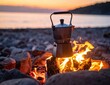 © AzamGold - Coffee Maker on Firewood with Sunset Background by a Serene Lake Shore