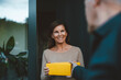 © Westend61 - Happy woman receiving package from delivery person at doorway