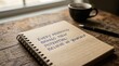 © andi - Inspirational Quote on Notebook with Coffee and Pen on Wooden Table.