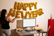 © Artem Podrez/Stocksy - Desktop mockup with white screen and happy new year balloons