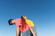 © Alba Vitta Studio/Stocksy - Couple Poses Together Under Clear blue Sky