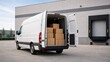 © Рудой Максим - Delivery van parked at loading dock with boxes inside during daytime