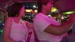 © blueringmedia - Happy Young Asian Couple Riding a Tuk Tuk in Bangkok at Night