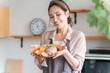 © buritora - A housewife preparing a one-plate lunch in the kitchen (cooking class, cooking school)