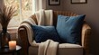 © Lubov - Wicker armchair near window with plush pillows and knit blanket. Dried grass in vase with lit candle. Cozy room ambiance, natural light creating warm atmosphere.