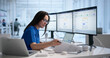 © Andrey Popov - Woman Reviews Medical Billing Codes On Laptop