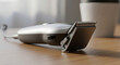 © abi - Modern electric hair clipper on wooden table close-up