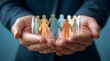 © Komang - Teamwork, business people and hands holding paper figures for support, unity and collaboration. Management, human resources and diversity with partnership, community and corporate protection culture