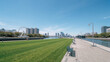© bephoto - 晴れた昼の親水公園から望む観覧車と近代的な港町