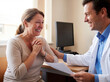 © Emre Akkoyun - Doctor discussing good news with happy patient in office, woman crying tears of joy after receiving positive health results
