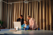 © DZ FILM/Stocksy - Three women working in the office