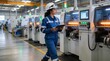 © JohnLee - Professional female engineer checking advanced machinery in modern factory