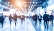 © Chandlerlikes - Soft blurred exhibition center with professional visitors and commercial event atmosphere