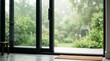 © Tikka MS - Modern sliding glass door opening to lush green backyard garden view.