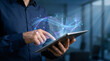 © sohel - Business professional holding tablet with digital network hologram overlay