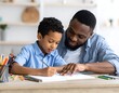© Giyo - African American father and son drawing.