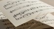 © Hay - Close-up of Sheet Music with Musical Notes and Symbols on Paper.