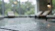 © Blurred Bokeh - Weathered Reclaimed Pine Wood Tabletop on Contemporary Outdoor Sky Lounge with Architectur Architect