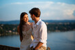 © Zoran Jesic - Young couple enjoying romantic sunset view over lake