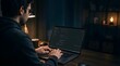 © Nora - Focused programmer working on coding project on a laptop at night in dark room