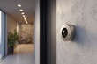 © Dimas - Modern security camera mounted on textured wall in illuminated hallway