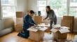 © CG - Man and woman unloading boxes in a room during a moving day scene.