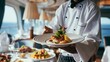 © Vitalii Shkurko - Chef Serves Gourmet Seafood Dinner in Luxury Cruise Restaurant With Ocean View and Elegant Interior During Fine Dining Experience