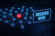 © Chanita - Glowing blue network map visualization with red highlighted node symbolizes critical alert. This serious concept illustrates an internal data breach and insider risk for cybersecurity