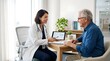 © fibekti - Doctor explaining medical information to elderly patient on tablet