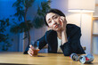 © metamorworks - お酒を飲んで感傷に浸る女性。お酒、居酒屋、悲しい、寂しい、孤独、落ち込む、がっかり、ひとり飲み
