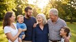 © Pixim Stock - Multi generational happy family smiling and laughing together outdoors in sunny park on summer day, embracing with love and joy.