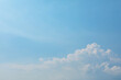 © spacezerocom - Soft blue sky background with minimalist white cumulus clouds at the corner
