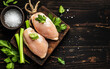 © Oleksiy - raw chicken fillets on wooden cutting board, top view